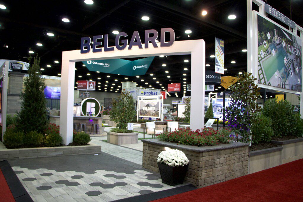 Belgard booth at Hardscape North America. The booth features a white arch with Belgard spelled out at the top