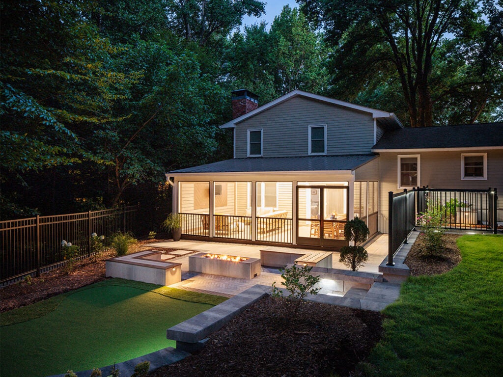 Backyard patio space with putting green and Belgard Artforms. 